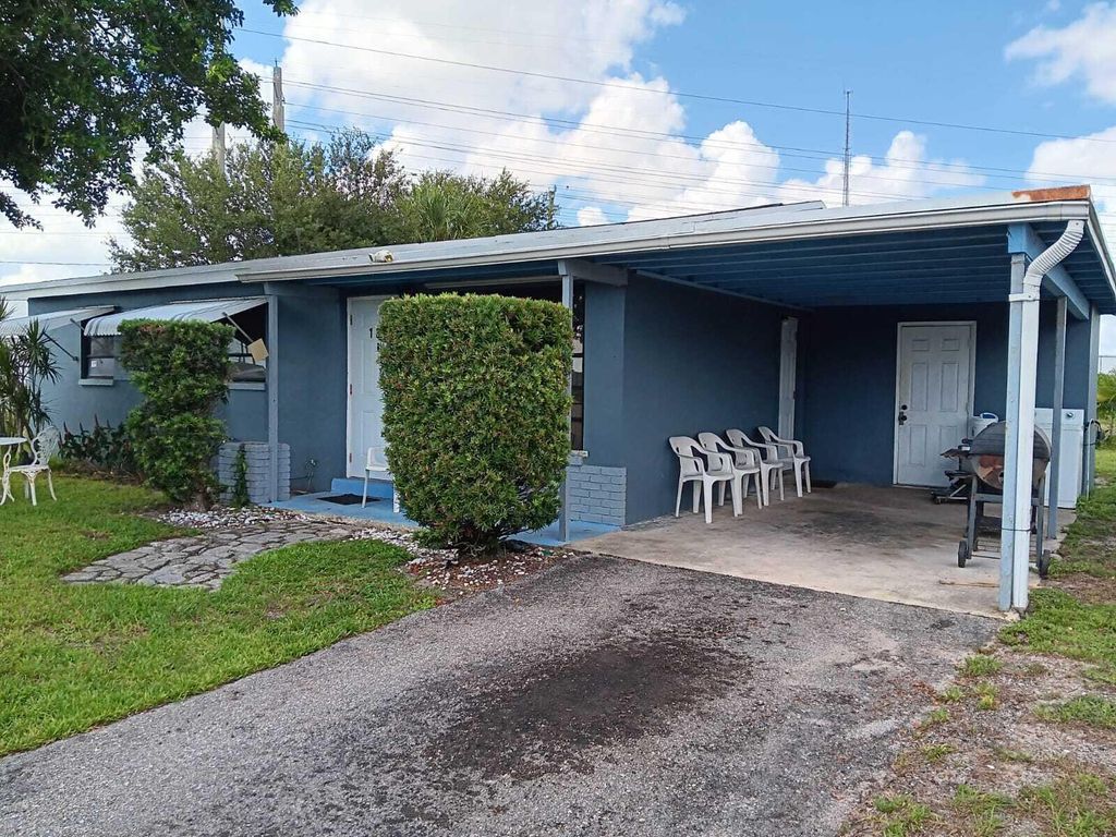 Photo of 1391 W 1st Street, Riviera Beach, FL 33404 (MLS # R11012992)