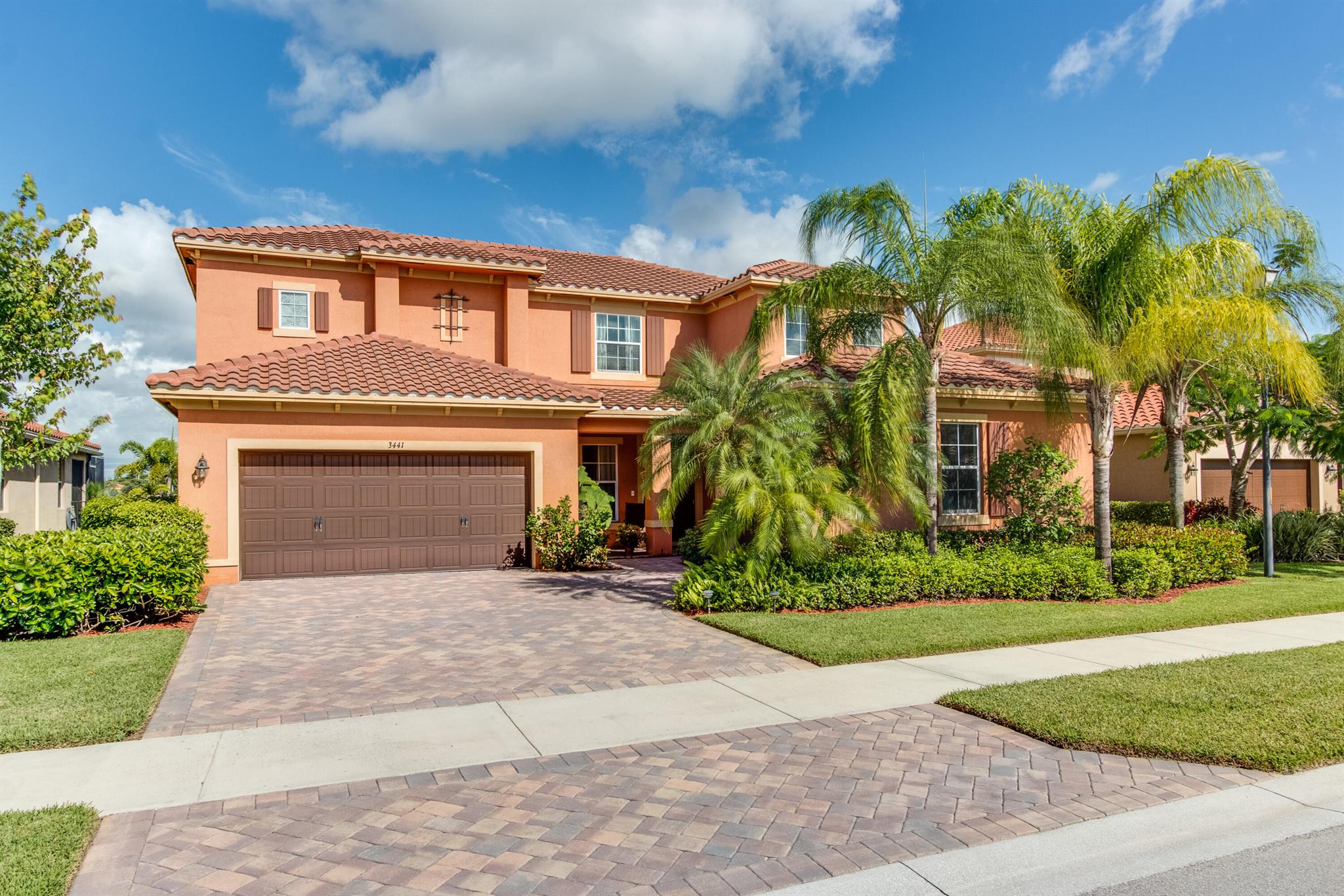 ---RENTED FURNISHED ONLY---WEST OF 441; 3 EASY MILES TO WEF - ALL BACK ROADS DOWN PIERSON. (All carpet has been replaced with NEW vinyl plank flooring) This is the one you've been waiting for! Popular 4/4 + (private office/nursery off master) 'Pearl' model w/ sweeping lake views! You are greeted w/ grand iron banister staircase. Generous dining rm & living rm w/ dramatic high ceiling. Open island kitchen w/ granite, subway tile back splash, stainless appliances, walk-in pantry & raised bar. Open concept family room is adjacent & downstairs guest room has full bath. Upstairs master bedroom suite + office and 2 additional bedrooms and 2 baths, both en-suite. Enjoy an outdoor oasis, evening sunsets & al fresco dining under covered patio w/ sprawling lake views! HURRICANE IMPACT WINDOWS