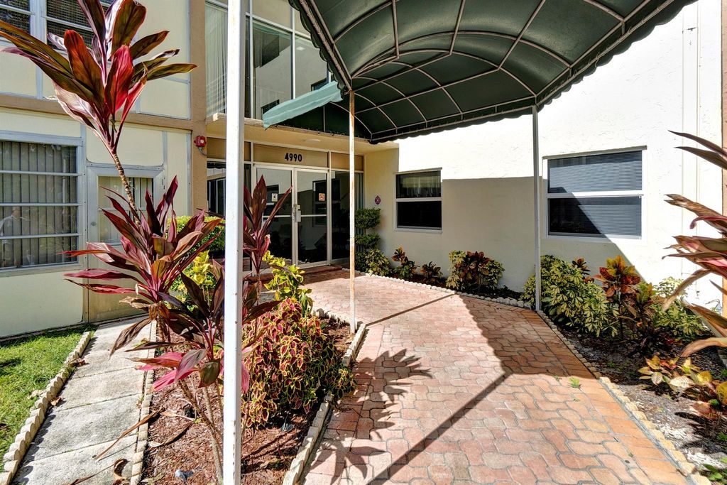 Photo of 4990 E Sabal Palm Blvd #306, Tamarac, FL 33319 (MLS # F10517176)