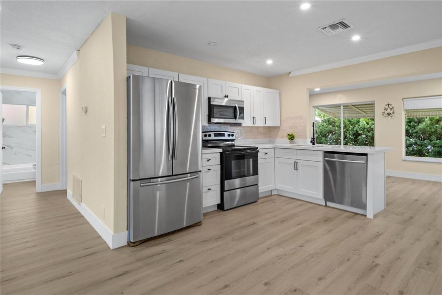 Priced below appraisal value! Very quiet street in the Mainlands of Tamarac. 55+ community. One occupant must be 55 and over. Home has a newer roof, newer attic insulation and new AC ducts. One full bath and the other bathroom does not have a shower.  The kitchen is GORGEOUS - soft close cabinets and drawers, quartz countertops, recessed LED lighting, and a modern subway tile backsplash. The entire home has luxury vinyl plank flooring which is 100% waterproof. – the flooring is beautiful! Home has a transferable Termite warranty! New gutters, updated electric panel, and IMPACT windows. Stacked washer and dryer unit is located on the outside covered patio area.  Monthly HOA fee is $100. No Children under 18. Yes, the HOA does require a 730 Credit Score(TransUnion). See MLS attachments.