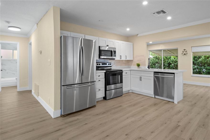 Priced below appraisal value! Very quiet street in the Mainlands of Tamarac. 55+ community. One occupant must be 55 and over. Home has a newer roof, newer attic insulation and new AC ducts. One full bath and the other bathroom does not have a shower.  The kitchen is GORGEOUS - soft close cabinets and drawers, quartz countertops, recessed LED lighting, and a modern subway tile backsplash. The entire home has luxury vinyl plank flooring which is 100% waterproof. – the flooring is beautiful! Home has a transferable Termite warranty! New gutters, updated electric panel, and IMPACT windows. Stacked washer and dryer unit is located on the outside covered patio area.  Monthly HOA fee is $100. No Children under 18. Yes, the HOA does require a 730 Credit Score(TransUnion). See MLS attachments.