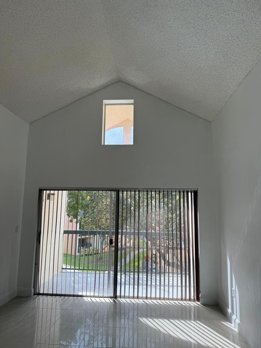 Welcome to this beautifully maintained 2 bedroom, 2 bath condo located in the desirable community of Lago Grande in Hialeah! This spacious corner unit offers an open concept layout filled with natural light, featuring tile floors throughout, a modern kitchen with stainless steel appliances, and a private balcony perfect for relaxing or entertaining. Enjoy the convenience of in-unit laundry and ample closet space. Gated community with 24- hour security, resort-style pool, clubhouse, and serene lake views. Centrally located near top-rated schools, shopping centers, restaurants, and major highways for an easy commute. Ready for immediate move-in - your perfect home awaits!