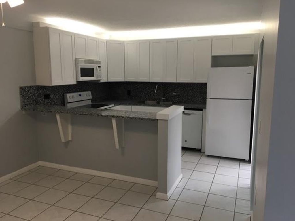 Photo of 1215 12th Lane, Palm Beach Gardens, FL 33418 (MLS # R11165848)