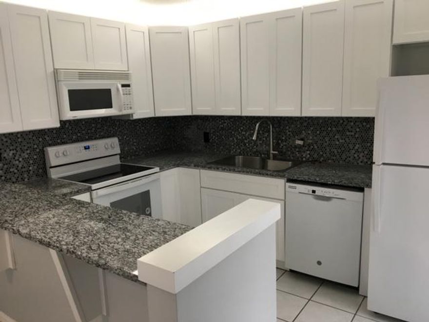 ** Two Bedrooms PLUS Den ** Two and One Half Bathrooms ** Newer Cabinets, Granite Tops & Back Splash ** New Range and Microwave ** No Carpet Anywhere ** ''Wood Look'' Vinyl Plank Floors for Stairs & Bedrooms ** Ceramic Tile Down Stairs ** Super Large Patio with Privacy Fence ** Hurricane Shutters ** Landlord provides monthly Pest Control inside and out ** Great Community Location NOT near I-95  ** Community Amenities include Tennis, Racquetball and Basketball Courts & Kids Playground ** Fantastic Palm Beach Gardens Location ** Good Credit & Income Required ** First, Last, Security and $250 Refundable HOA Deposit ** Dog Considered but No Cats  **