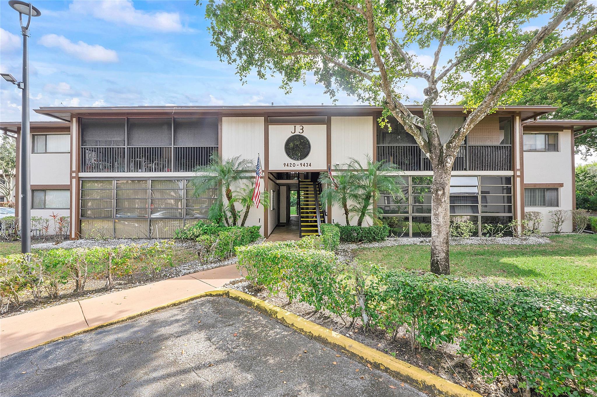 Great 2 bed convertible condo in Belfort at Kings Point Tamarac! 1st floor easily accessible 2 bedroom with spacious screened patio. Brand new full-size washer & dryer. Open concept kitchen, dining area and spacious entertaining space. Primary bedroom has an oversized walk-in closet - perfect for storage & new shopping trip purchases. Newer A/C and Water Heater & Newer Roof! Belfort is gated & has a gorgeous resort heated pool & roofed cabana - perfect area to enjoy the sun, meet friends or participate in a card game. The main Kings Point clubhouse is next door & a quick walk, drive or Kings Point trolley ride away. The main Kings Point clubhouse has been renovated with a beautiful ballroom, billiards, card room, craft area, state of the art fitness center and theater. Rec lease paid!!