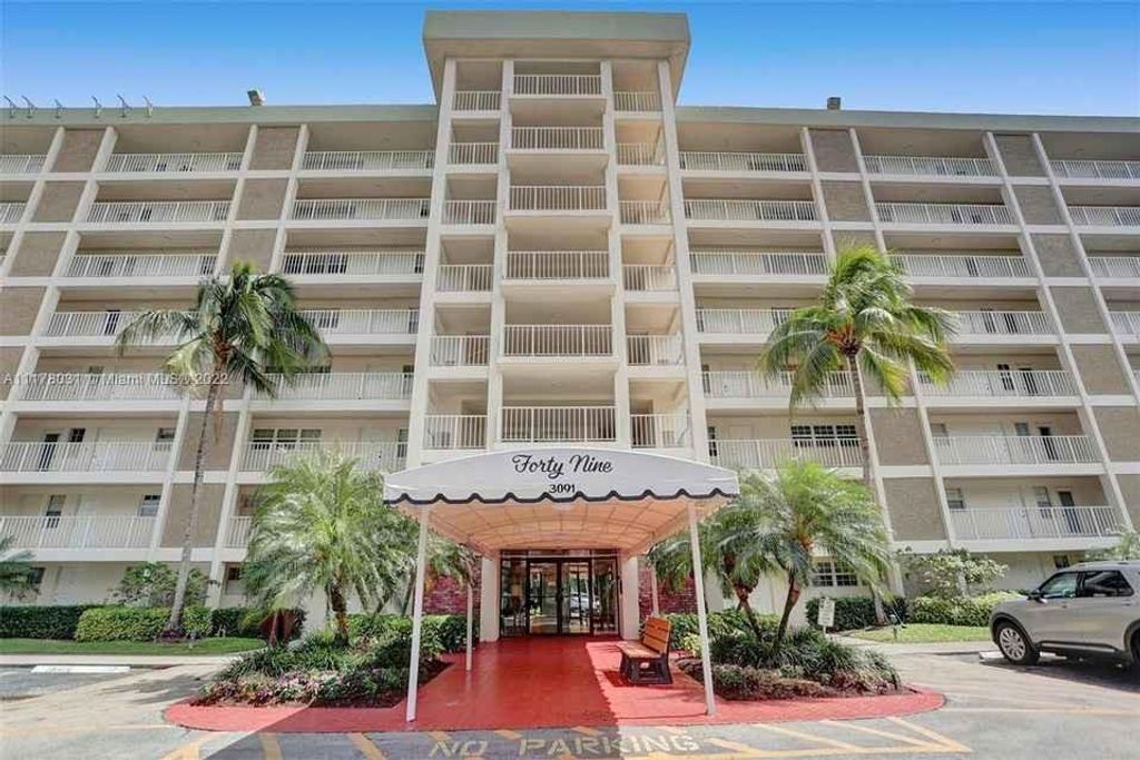 Photo of 3091 N Course Dr #304, Pompano Beach, FL 33069 (MLS # F10334354)