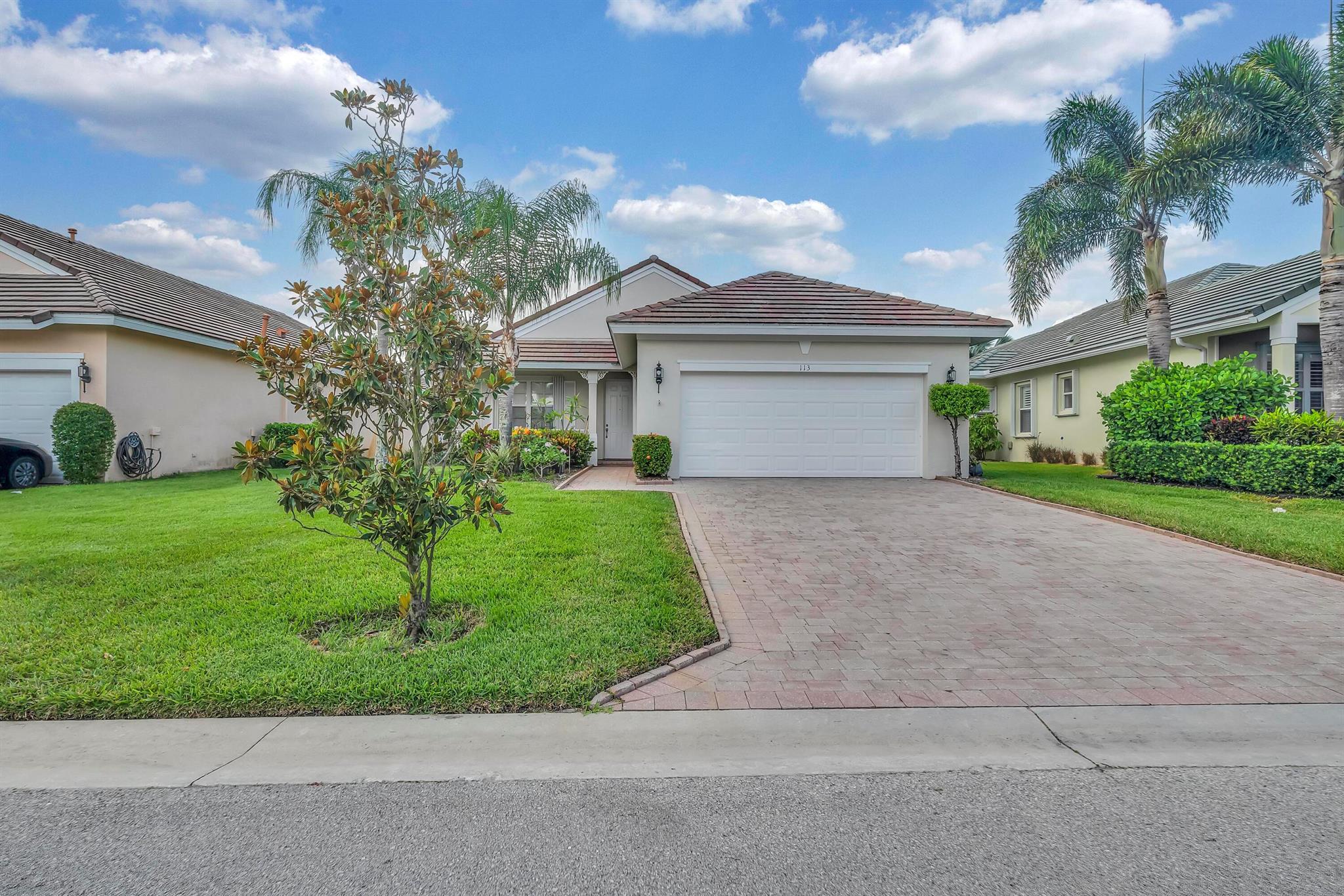 Nestled in the desirable gated community of Magnolia Lakes in Port St. Lucie, this light-filled home offers a comfortable and open layout with high volume ceilings. Recent updates include a newer A/C system (2023), Fresh Exterior Paint and accordian shutters! The main living area features newer tile flooring. and flows seamlessly into a large screened patio offering a peaceful retreat. Kitchen features stainless steel appliances. Magnolia Lakes provides a variety of community resort-style amenities, including a clubhouse, pool, tennis courts, and more. This well-maintained home presents a great opportunity to enjoy a relaxed lifestyle in one of Port St. Lucie's established neighborhoods. All ages community and no CDD.