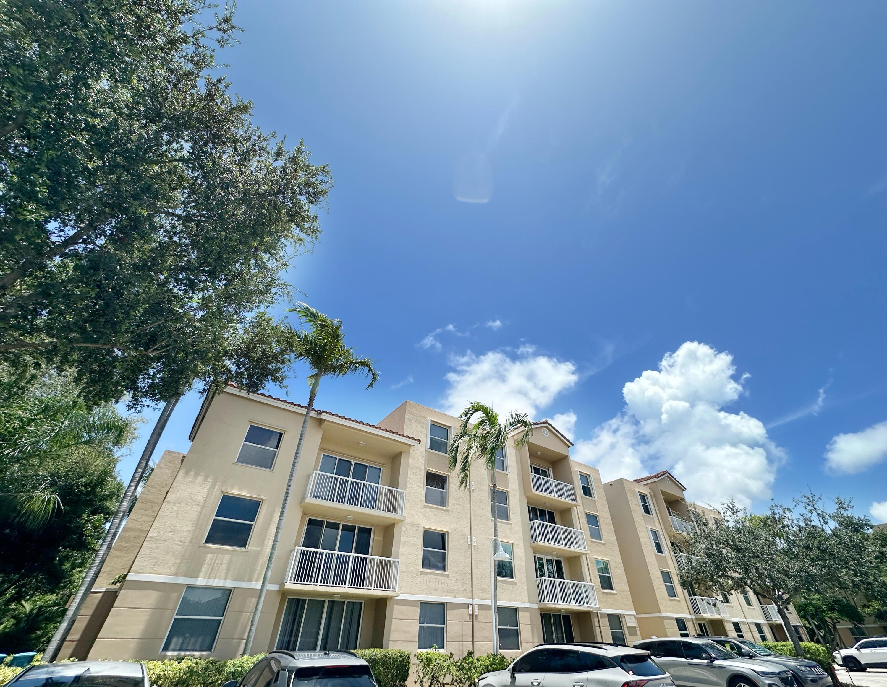 Live the Beachfront Resort Lifestyle!! Just 3 mins from the beach and 2 mins to shopping, dining, and essentials. Located in a quiet, gated community near A1A and only 2 miles to I-95. This rare and bright corner unit features a spacious kitchen with granite countertops, stainless steel appliances, and plenty of workspace. Quality ceramic tile and laminate flooring throughout. Large bedrooms with walk-in closets, ceiling fans in every room, and a full-size washer & dryer in-unit. Extra windows and a sliding glass door fill the space with natural light. Enjoy a well-kept community with a good-sized pool. Bike path directly leads to the ocean. Don't miss this comfortable, convenient coastal living!