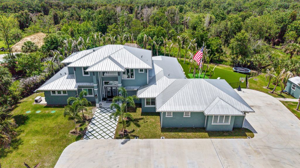 Photo of 6154 SW Woodham Street, Palm City, FL 34990 (MLS # B26030005)