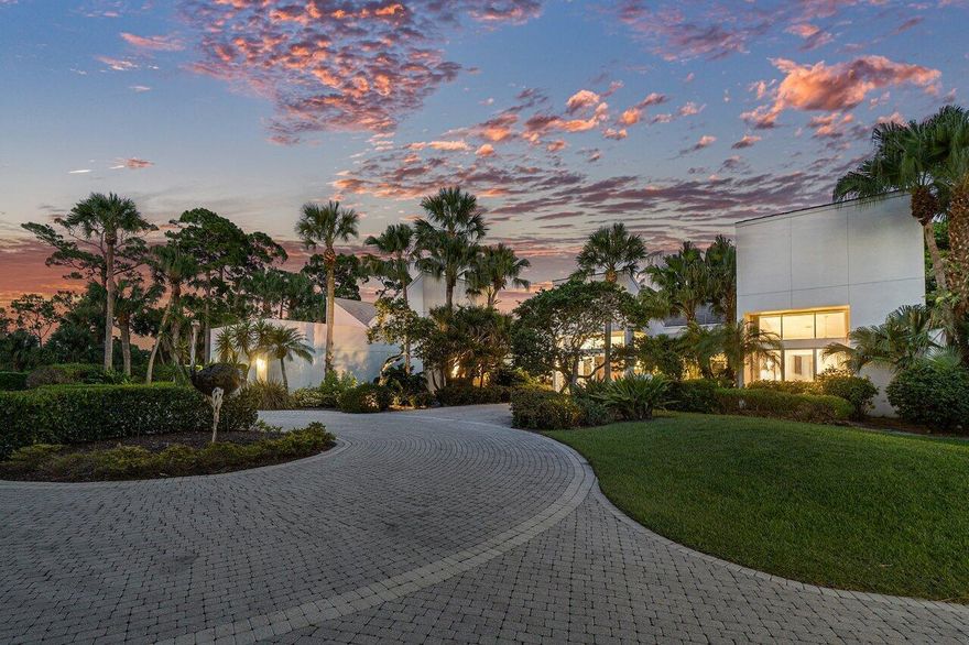 Located in The Enclave - An Exclusive gated community within the Breakers West Country Club. This property has Sherle Wagner's artistic eye and craftsmanship reflected throughout with custom stone hardware, rose quartz bath, Burlwood bookcase, and a floor to ceiling marble fireplace. Designed for privacy, the outdoor tropical oasis has a large, heated pool and dining/ entertaining area overlooking the lake and golf course, situated to feel like your own private estate.