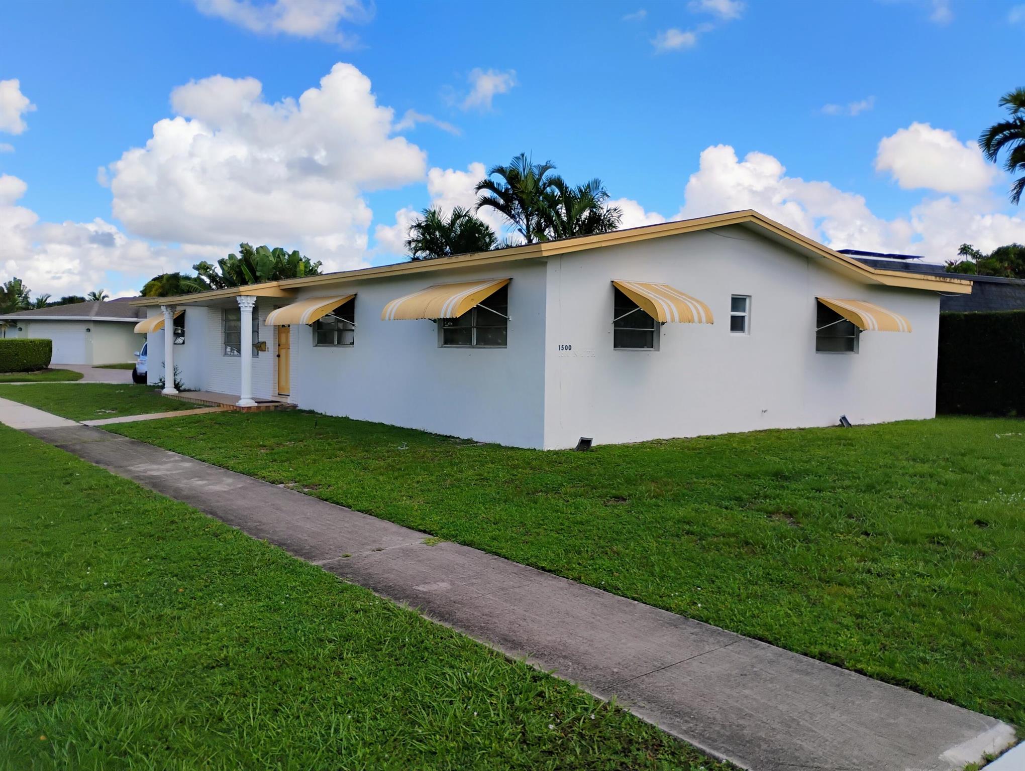 Make this spacious corner Hollywood Hills home yours! Bright and clean! Oversized garage and back porch. AC 4 years old. Master bedroom has own private entrance from porch. Located in a quiet neighborhood, yet close to everything!