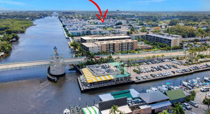 Beautiful condo directly across from the pool & clubhouse! Enjoy pool views from this upgraded condo! Remodeled wood kitchen, granite counters, stainless appliances with new refrigerator & new stove. Freshly painted & plank style floors. New blinds just installed. Matching pub table with storage for dining. Upgraded bathroom shower with tub. Large covered & screened balcony. Accordion shutters for protection. Intracoastal community - walk by the seawall & watch the boats go by. Great downtown location walk to   restaurants, shops & festivals, Active community assoc states 55+ with social clubs, cards/games, dance & events! Clubhouse remodel in progress. Many amenities to enjoy including community pool, shuffleboard & Bocce Club courts!