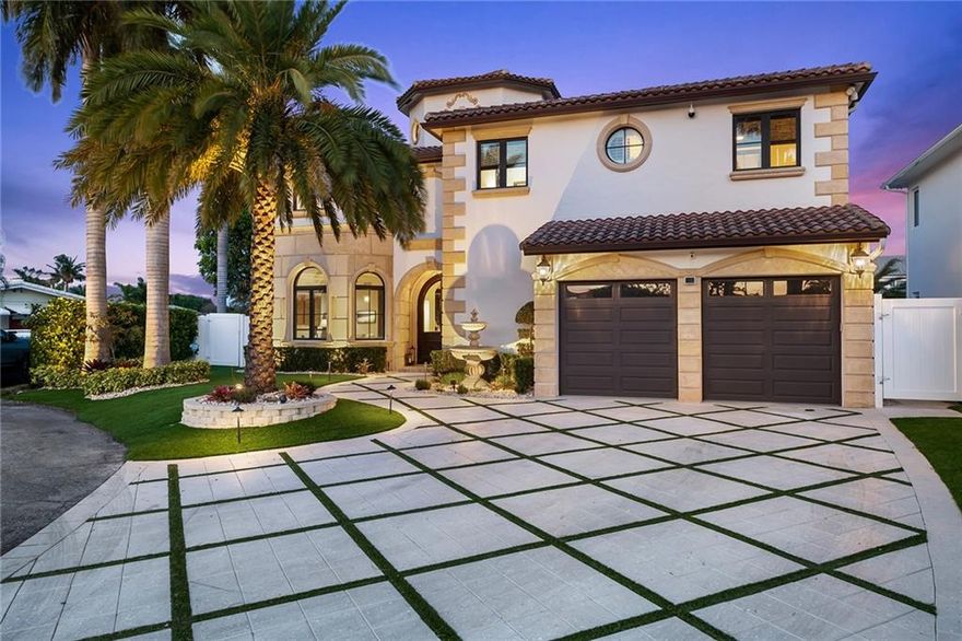 Welcome to paradise! This elegantly finished home has been impeccably maintained and is ready for an owner of discriminating taste.  The 6-bedroom, 6.5 bath home features marble floors, vaulted ceilings, beautiful dark wood trim and solid doors, grand staircase, and carved limestone fireplace.  This home checks all the boxes with full house generator, 95' concrete dock with 27,000 lb. boat lift, east exposure on the pool, patio and back yard, and is located at the end of a cul-de-sac street with no traffic.  Luxurious master suite has beautiful views with a balcony that overlooks intersecting canals, his and her baths, steam shower, and 2 very large closets with custom cabinetry.  Truly an ideal location to enjoy everything that south Florida has to offer.  This exquisite home won't last.