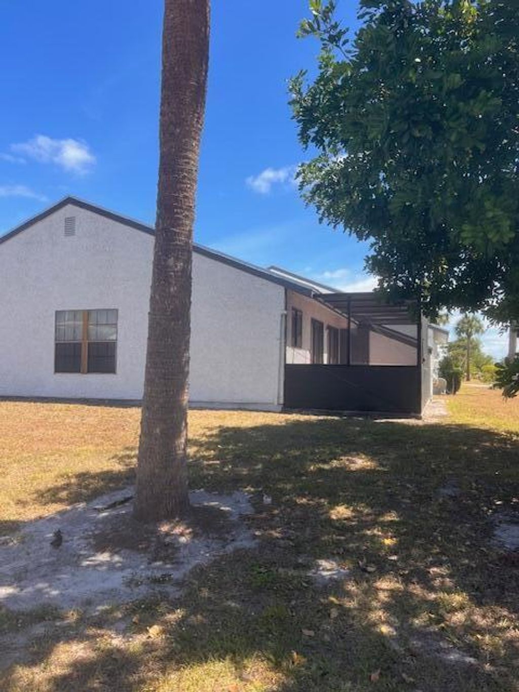 Photo of 401 SW Godels Street, Port Saint Lucie, FL 34953 (MLS # R10975823)