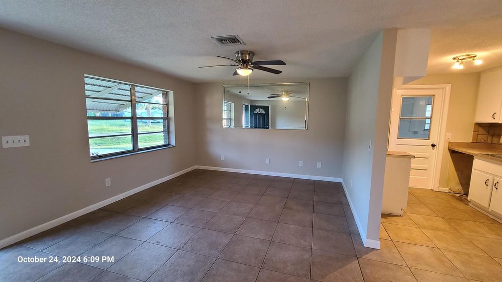 Photo of 401 NW Fairfax Ave, Port Saint Lucie, FL 34983 (MLS # R11033703)