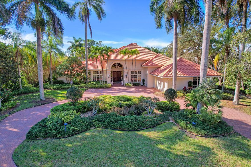 BEAUTIFUL LANDSCAPED LOT ON A QUIET STREET CLOSE TO CLUBHOUSE.