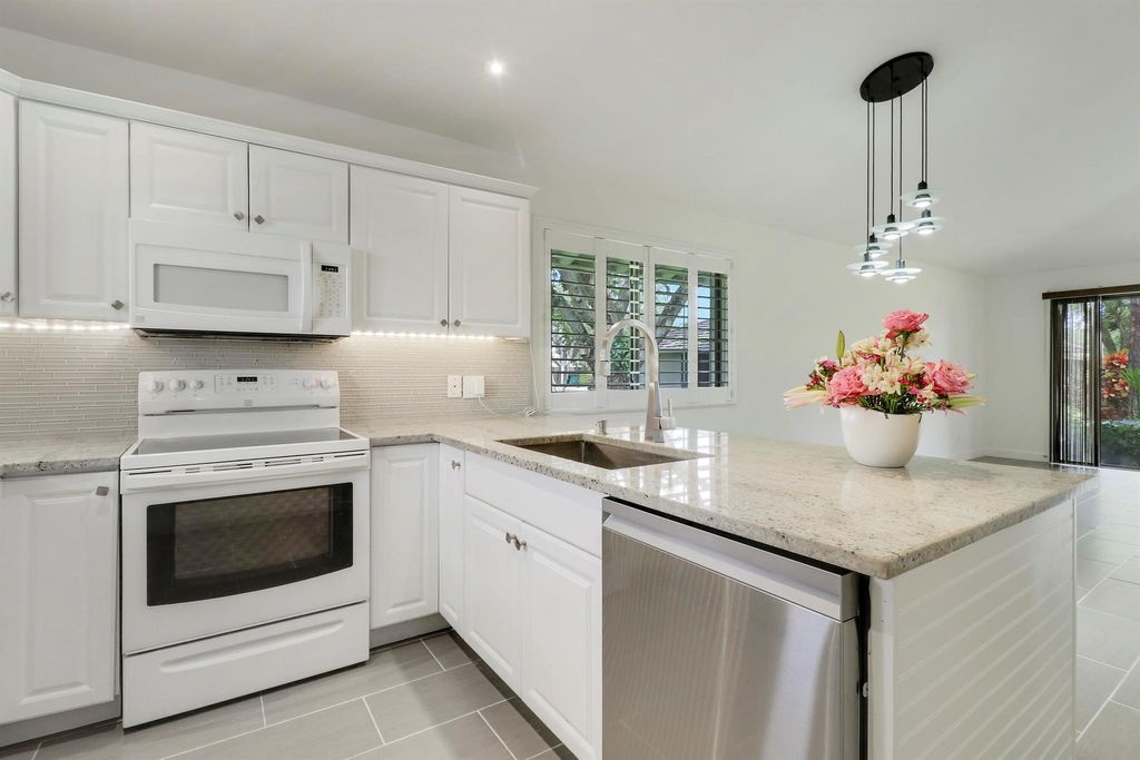 Photo of 534 Club Drive, Palm Beach Gardens, FL 33418 (MLS # R11106881)