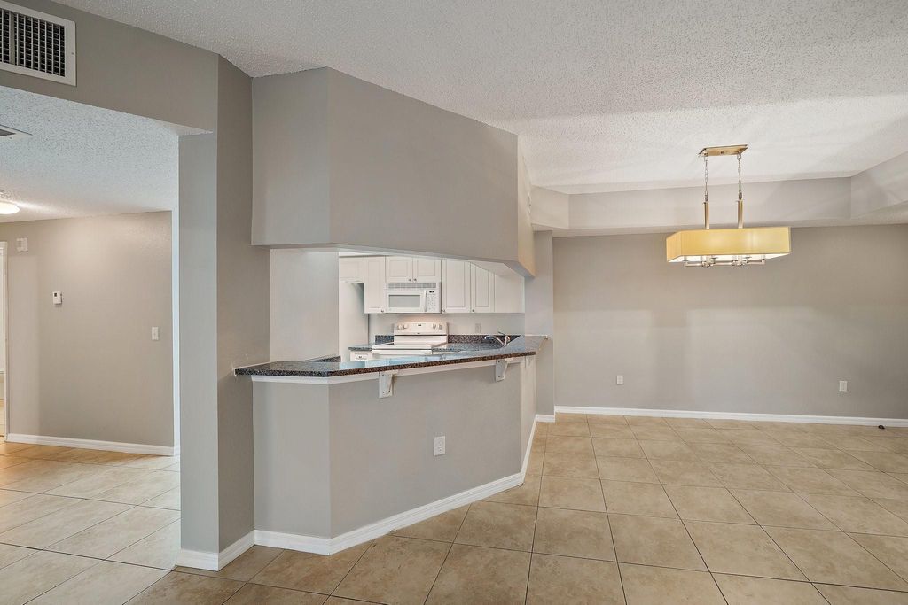 Photo of 3020 Alcazar Place #204, Palm Beach Gardens, FL 33410 (MLS # F10417374)