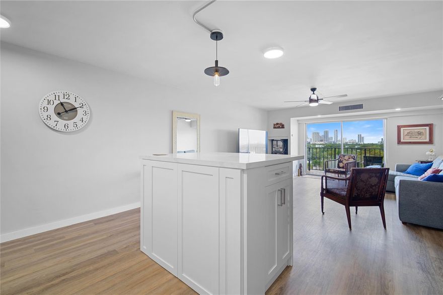 Modern, walkable 1BD/1BA with quick access to Las Olas, Downtown Fort Lauderdale, and the beach! This bright, north-facing condo features an open kitchen with center island, soft-close cabinetry, quartz countertops, and stainless steel appliances - flowing into the light-filled living/dining area and private balcony with peaceful city views. Updated vinyl flooring and a refreshed bathroom create a clean, move-in-ready feel, while keyless entry adds everyday ease. Spacious bedroom with generous walk-in closet. The well-maintained building offers resort-style amenities: pool, tennis court, gym, sauna, library, shuffleboard, and clubhouse. Ideally located near cafés, restaurants, marinas, grocery stores, and essentials—leave the car and embrace a vibrant, low-maintenance coastal lifestyle!