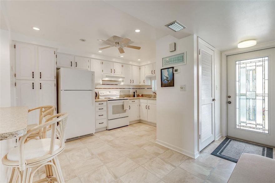 SPECTACULAR WIDE LAKE & WIDE 17th PGA Fairway. BRIGHT CORNER,2BR/2BA, 1,170 SF.. Wide open kitchen with high ceiling and mini LED lighting.  Snack bar is perfect for looking out to the lake and majestic golf view. NO POPCORN Ceilings. Newer AC. New,100% waterproof vinyl plank flooring in Master Bedroom. Recreation Lease PAID IN FULL! FREE golf (except cart fees) on two 18 hole courses (PGA & Par3); Amenities include Restaurant, Billiard Room, Bbq/Picnic Area, Clubhouse, Courtesy Bus, Exercise Room, Heated Pool, Library, Putting Green, Sauna, Shuffleboard, Tennis, Pickle Ball, Vehicle Wash Area, Electric Car Charging Station. Close to shopping, dining & highways. 15 min. to beach. Association says 55+ age required; BEST VIEWS!