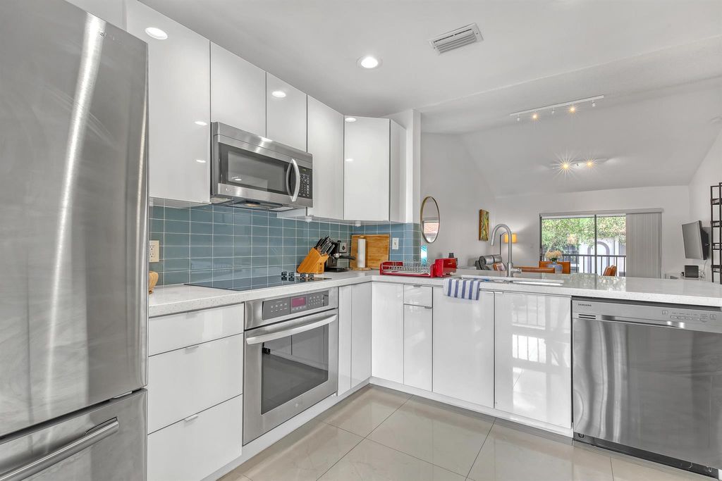 Photo of 300 E Club Circle Circle #204, Boca Raton, FL 33487 (MLS # R10938861)