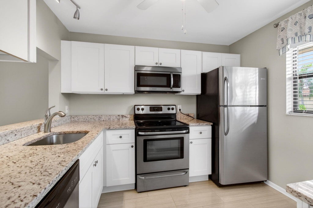 Photo of 7245 Golf Colony Court, Greenacres, FL 33467 (MLS # B26089497)