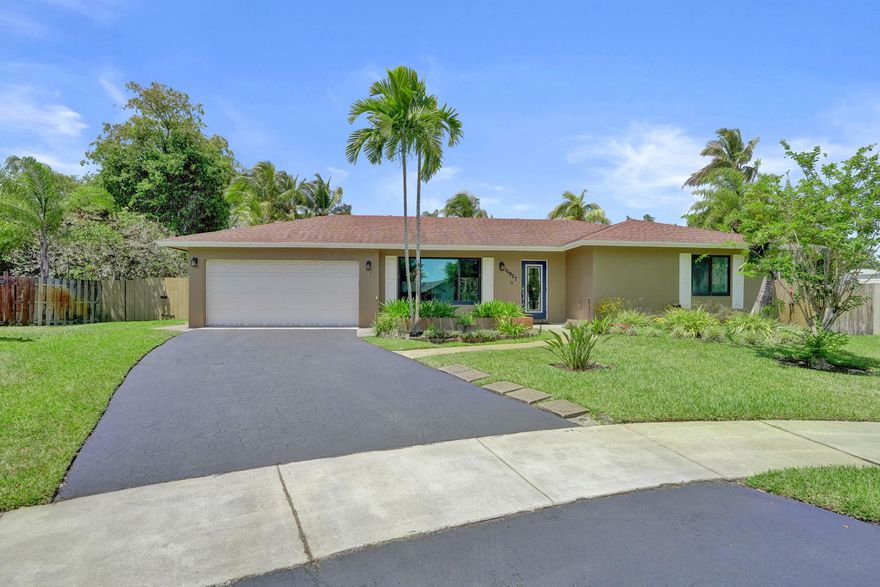 Welcome home!  Your quality built Pasadena Homes Banyan Floor Plan is perfectly tucked in the Cul-De-Sac on one of the largest lots in Flamingo Gardens.  You will love to entertain friends and family for pool parties and summertime bar-b-q's with the huge back yard and large covered patio.  Peace of mind during storm season with full hurricane impact doors and windows and a brand new flat roof.  The large living area, family room, and dining room are perfect for families of all sizes.  Don't miss this opportunity to live in one of the safest communities and best school zones in Broward County.  Call to schedule your showing today!
