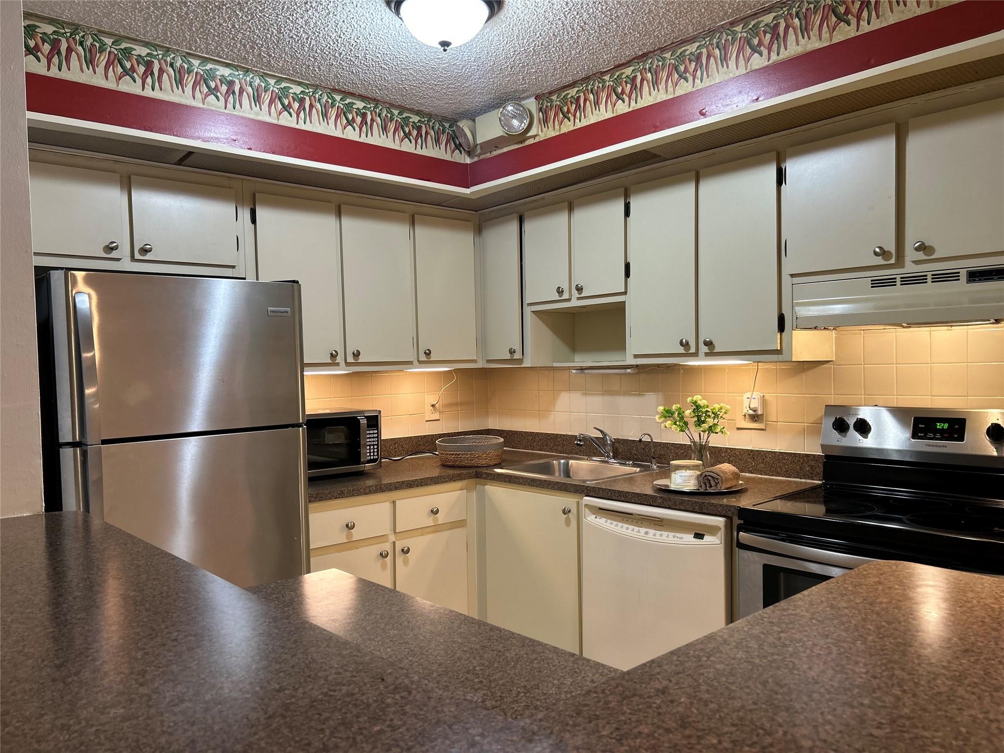Beautiful maintained first floor unit, currently used as 1 bedroom 2 bath but can be converted to 2 Bedroom, tile throughout, glass enclosed screen terrace with WASHER and DRYER in the unit, Roll-Ups on Terrace also. 24 hour gated community. 55+ Active adult community offers, Clubhouse, pools, spas, sauna, billiard room, tennis, gym and more. State of the Art Theater. Many clubs to keep you busy. Close to everything. Transportation provided for residents. RENT INCLUDES WATER,GATE SECURITY, GARBAGE, BASIC CABLE, INTERNET, GYM, ALL AMENITIES.