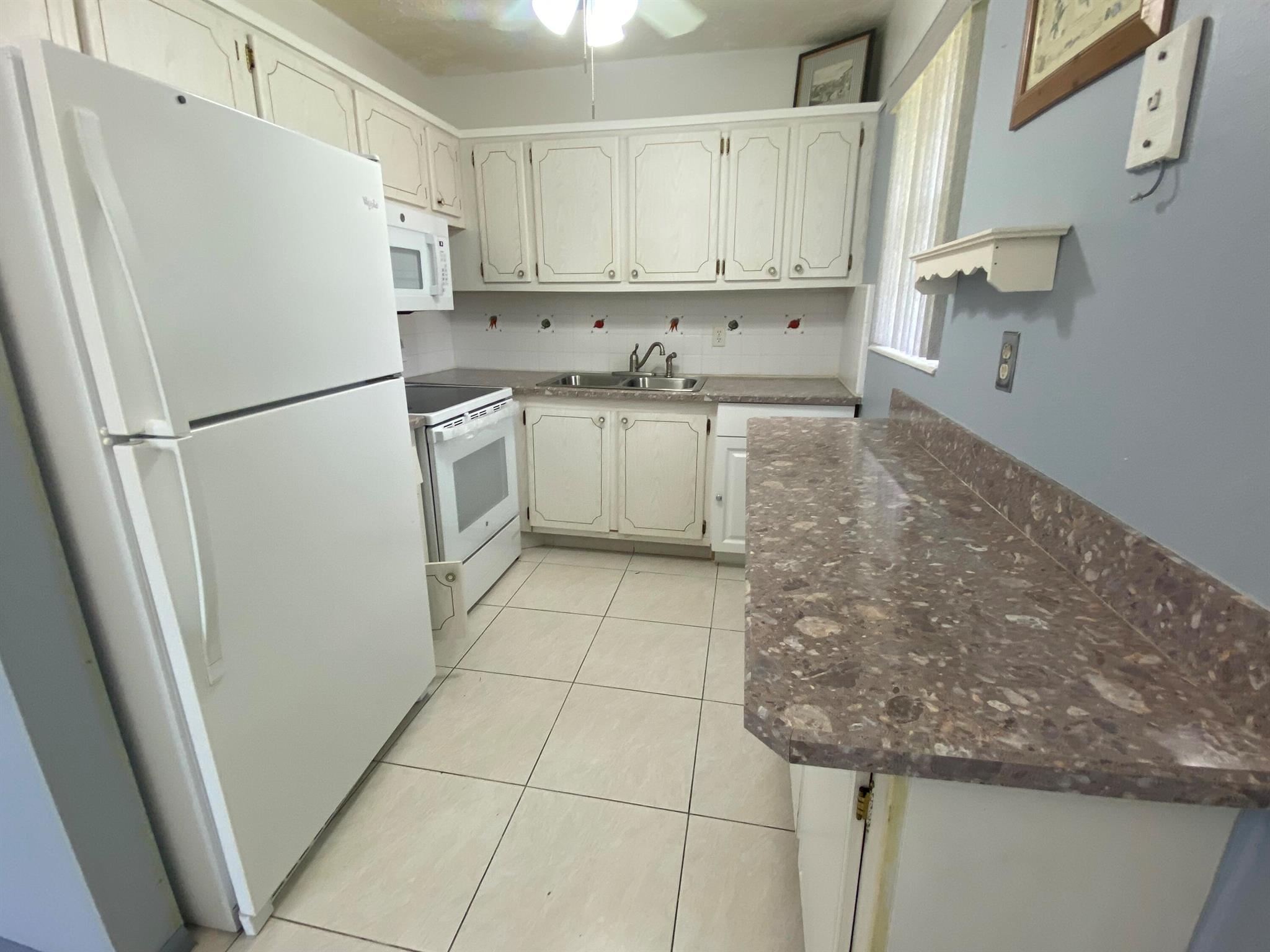 For rent in a 55 + retirement community a 2 BD, 1.5 BA condo located on the 2nd. floor of a well kept building. This corner has Central Air. The unit lets in plenty of sunshine through windows in the kitchen, dining room, bedroom. Enjoy many amenities of resort style living, like 1000 seat clubroom to watch shows and movies, indoor and outdoor pools, courtesy bus service, medical facilities, drug store, beauty shop, tennis, boating and more. Close proximity to PBI airport, restaurants, shops and beaches