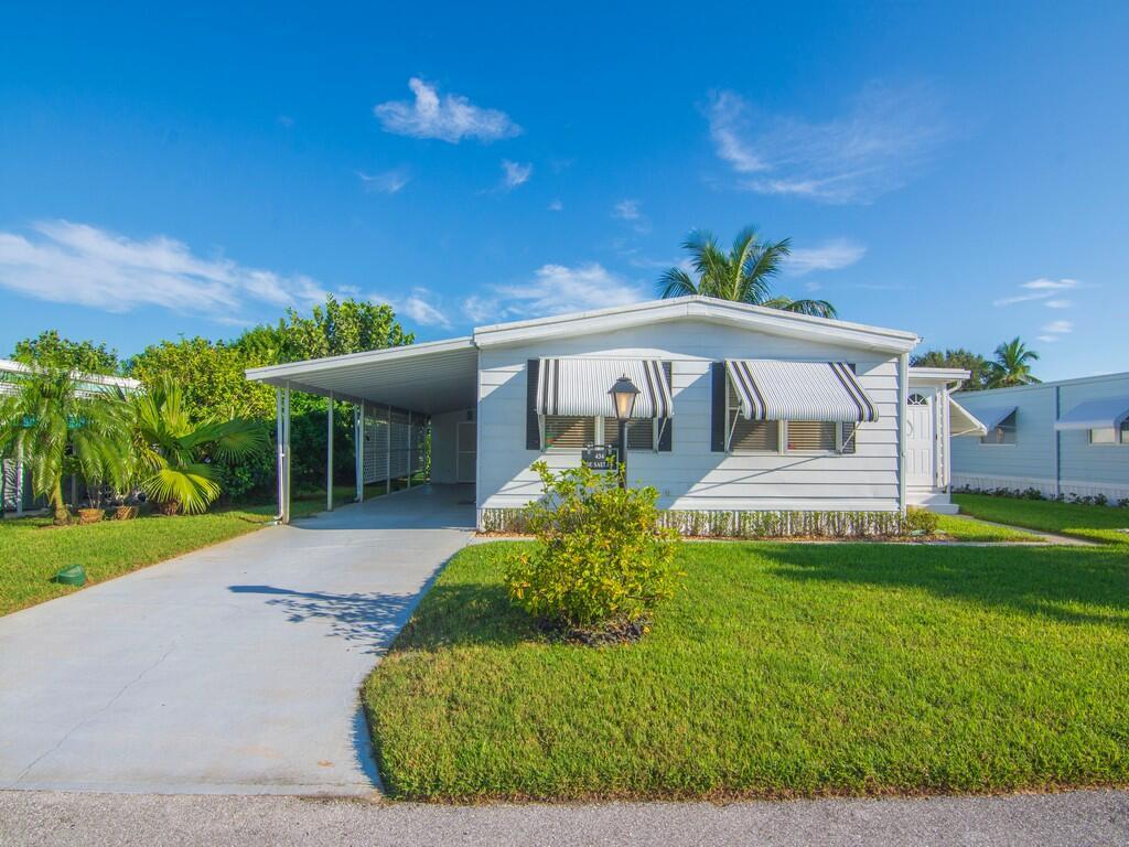 WELCOME HOME to the beautiful 55+ community of Pinelake Village! This home features new floors, an inviting and open layout, 2 bedrooms, 2 bathrooms! Newer AC, appliances, and vanities! Enjoy your own fruit trees - guava, banana, figs, and coconuts! Schedule your private showing today!