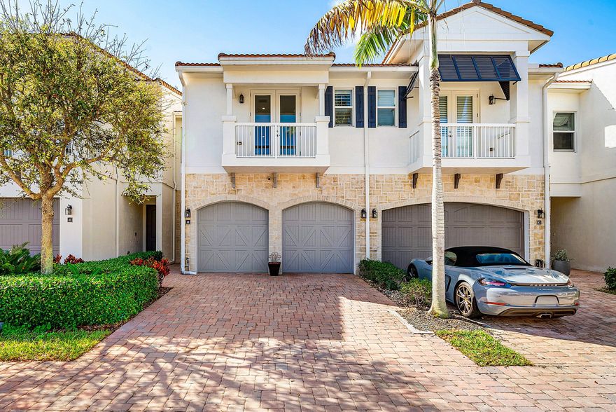 Located in the exclusive gated community of Valletta, this beautifully maintained 3BR/2.5BA townhome built in 2016 offers modern design and spacious living in the heart of East Boca. The open-concept main level features soaring ceilings, wide-plank wood floors, and a stylish kitchen with quartz countertops, stainless steel appliances, a large island, and pantry. A beautifully crafted custom bar with draught tap and beverage fridge creates the perfect entertaining space. Upstairs offers three spacious bedrooms, a versatile loft, and laundry room. The primary suite features dual walk-in closets and a spa-like bath with soaking tub and separate shower. Fenced backyard with covered patio. Minutes to Mizner Park, Atlantic Avenue, and the beach.
