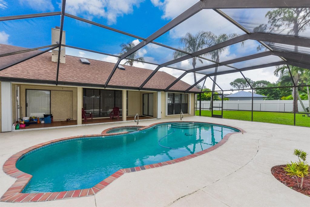 Photo of 2661 SE Opal Circle, Port Saint Lucie, FL 34952 (MLS # R11006062)