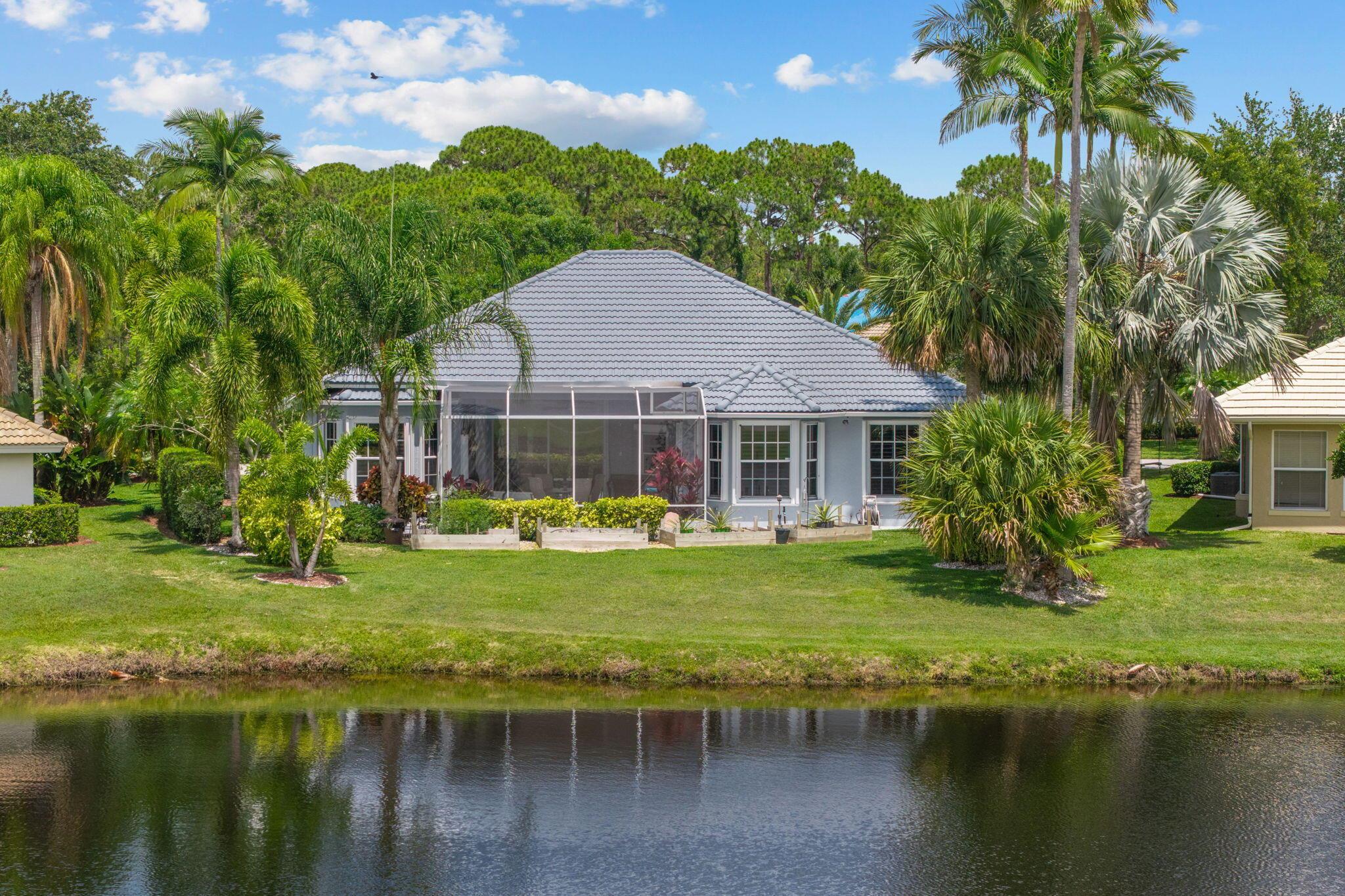 Welcome to Sanctuary Drive, of Country Club Estates. This home has a view! Sit on your patio and over look the water and the 18th fairway of St Lucie Trails Golf Course. Spacious open concept family room and granite kitchen with stainless appliances. Large primary suite with walk in shower, soaking tub, 2 walk in closets and dual sinks. 2 additional bedrooms and bath with 2 car garage. Upgrades include: Custom white Plantation shutters on windows, new garage door motor & chain w/ remotes, new 200amp service panel, Exterior of home has been painted including patio floor. Water heater new in 2021.