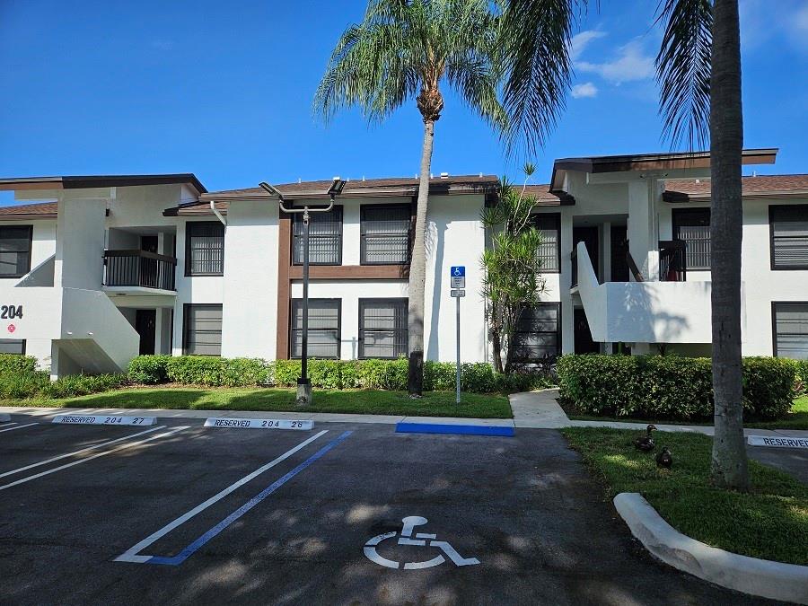Absolutely beautiful fully renovated 2/2 2nd floor condo. Brand new kitchen with granite counter tops, brand new fridge, stove, dishwasher and disposal. Brand new bathrooms showers with new vanities. Brand new faucets and lighting fixtures. Brand new laminate in living and bedrooms. walk in closet. Storage space inside and on the balcony. Hurricane impact window screens. Washer and dryer inside.