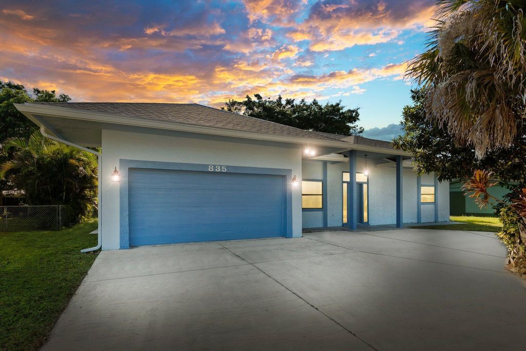 Photo of 835 SE Airoso Boulevard, Port St Lucie, FL 34983 (MLS # R10933424)