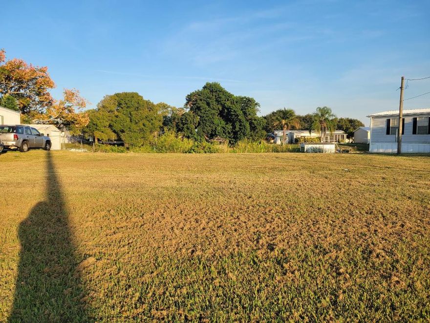 Waterfront Lot In Taylor Creek Isles. Lake Okeechobee access with no fixed bridges. Close to local shopping and schools. Ideal area to build your new home or mobile home.  Call for details and to schedule a viewing.