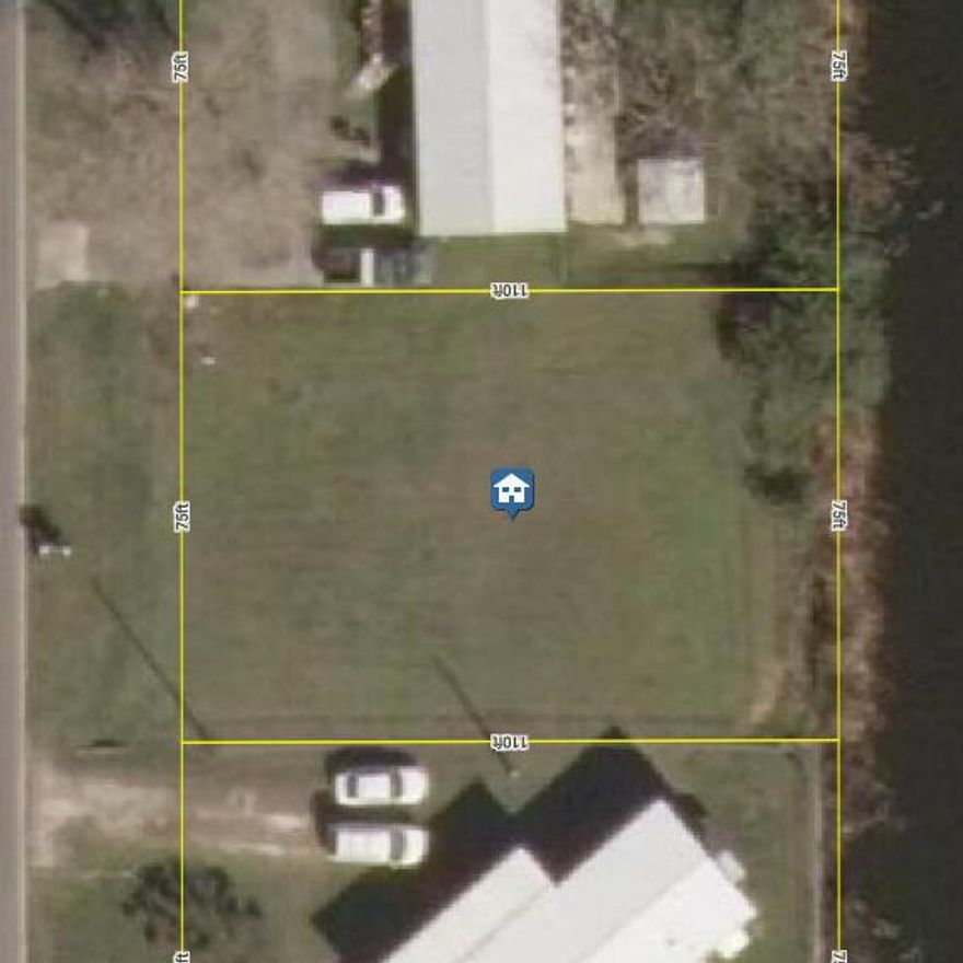 Waterfront Lot In Taylor Creek Isles. Lake Okeechobee access with no fixed bridges. Close to local shopping and schools. Ideal area to build your new home or mobile home.  Call for details and to schedule a viewing.