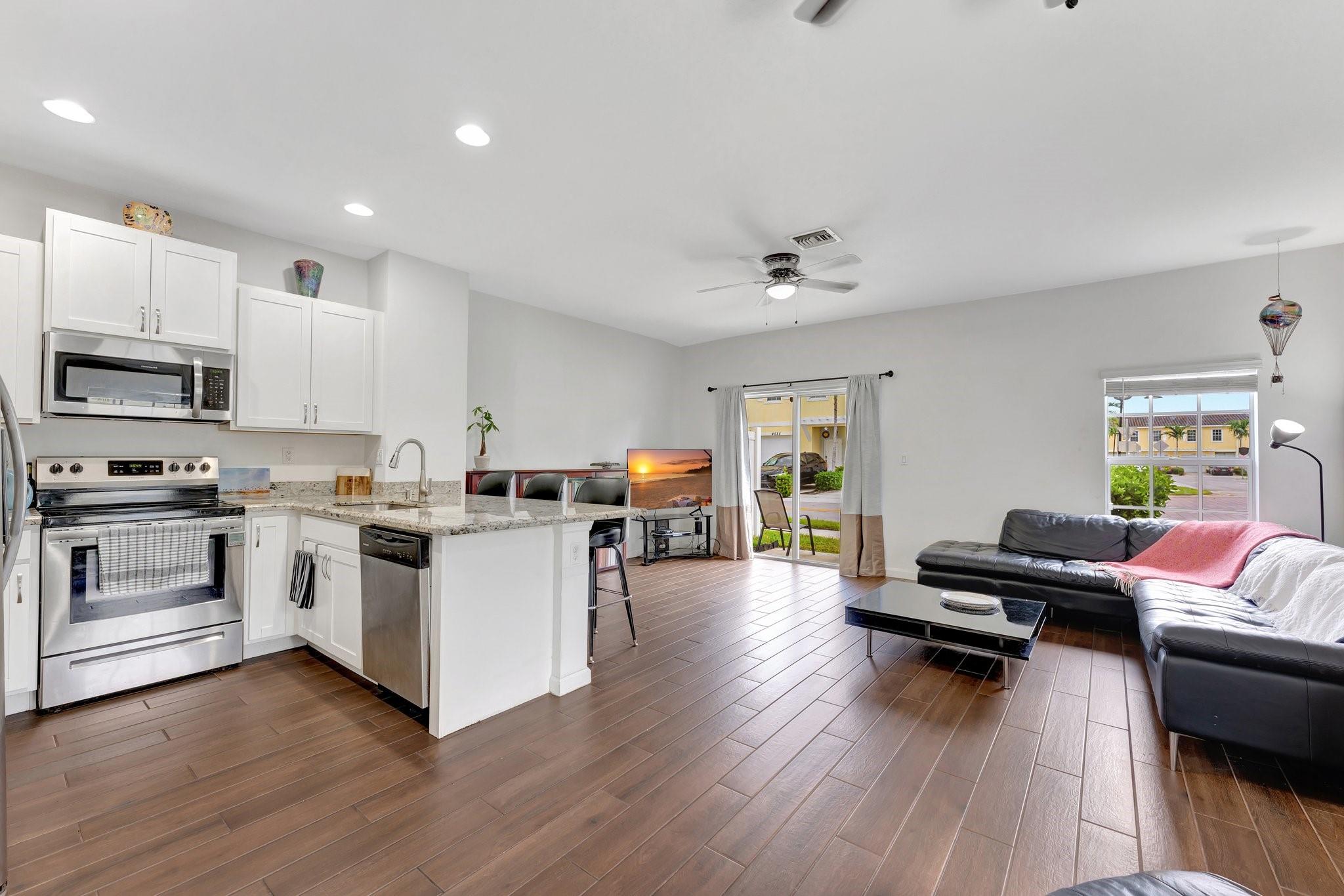 This spectacular newer construction CORNER UNIT townhome in a well-lit gated community in central Broward Country, built in 2018, is FHA & VA approved and has had only one set of owners. Well-maintained 3BR/2.5BA with SS appliances, wood cabinets, ceiling fans throughout living spaces, plank tile on both floors and stairs, and an open, light & airy floor plan. All bedrooms are upstairs with ample closet space. Accordion shutters throughout for your wind mitigation discount. Includes 1-car garage, 2 outdoor spaces, guest parking adjacent to and directly across from the property, and a semi private outdoor patio. A/C is fairly new. Minutes from beaches, major highways, FLL Airport/Seaport, restaurants, retail, entertainment & Las Olas. Incredible price and location for an almost new home!