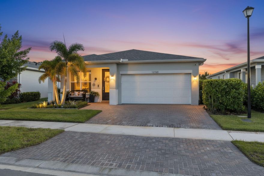 Seller Motivated. Experience modern Florida living in this beautifully upgraded lakeview home located in the highly desirable Emery at Tradition. This move-in-ready residence features a heated saltwater pool with sun shelf, in-water seating, and spa jets, offering a private resort-style setting. Inside, enjoy a bright open layout with ceramic tile flooring, impact glass, vaulted ceilings, and abundant natural light. Residents enjoy the Tradition lifestyle, with access to parks, walking trails, schools, community events, dining, shopping, and Tradition Square—creating a vibrant, connected place to call home.