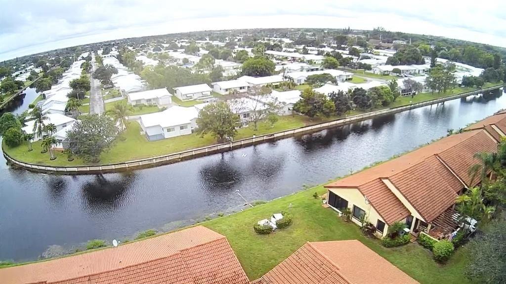 Rare Opportunity with Breathtaking Water Views. Welcome to this spacious and stunning 2 bedroom, 2-bathroom villa in the highly desirable Lake Colony community, nestled in the heart of Tamarac. This rarely available gem offers serene water views and a beautifully updated interior that’s move-in ready. Property Features: Brand new kitchen appliances, New Sink and Garbage Disposal, Remodeled master bathroom, freshly painted throughout, new blinds and ceiling fans, hurricane panels. All ages welcome, Clubhouse, pool, tennis, Basketball courts, and, conveniently located near major roads, shopping, dining, schools, Woodmont Golf Club, and Woodmont Hospital HOA Includes: Roof repair and replacement, Lawn maintenance, Community pool upkeep, Exterior building painting. Owner does not allow pets!