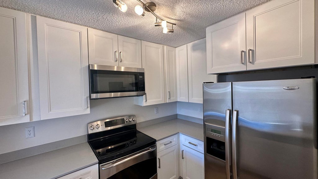Photo of 1631 E Cypress Way Way E, Palm Springs, FL 33406 (MLS # B26039095)
