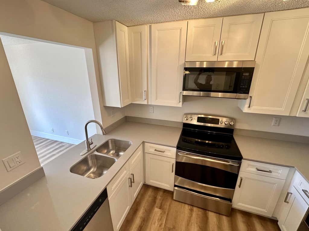 Photo of 1631 E Cypress Way Way E, Palm Springs, FL 33406 (MLS # B26039095)