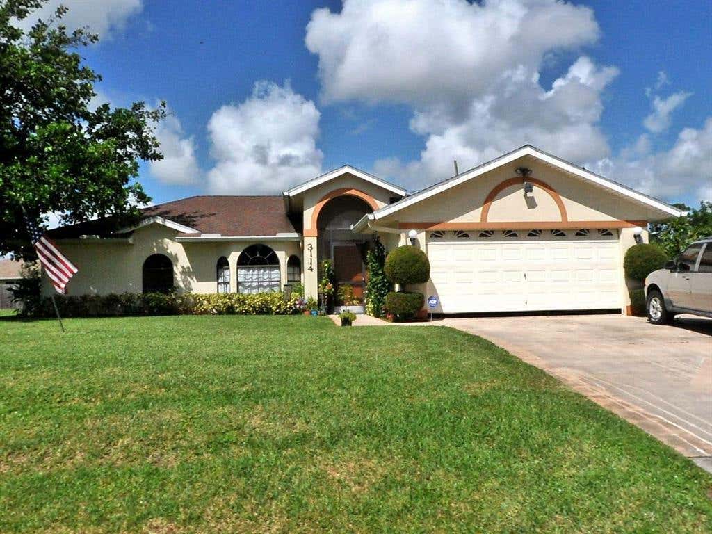 Photo of 3114 SW Armucher Street, Port Saint Lucie, FL 34953 (MLS # R10766597)
