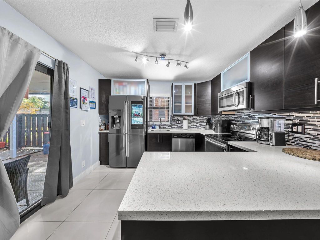 Photo of 2496 NW 99th Avenue, Coral Springs, FL 33065 (MLS # F10555550)