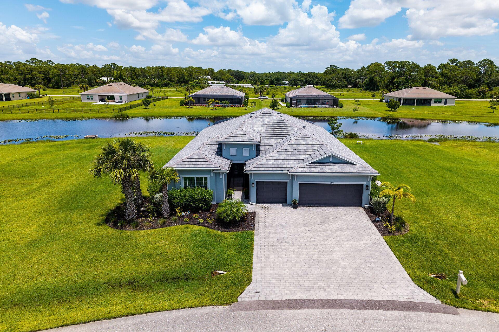 Are you longing for a taste of country life amidst your busy day? Imagine driving past horses and cows on your winding road or taking a stroll to the Caloosahatchee River to catch the sunset. If this sounds appealing, 17190 Serengeti Circle in Alva might be just what you're looking for. As soon as you enter the gated community, you are welcomed by a pair of lions and an elephant, making it clear that Serengeti stands apart from other subdivisions in the area. There are 17 homes, each situated on approximately one acre of land, this community offers a unique living experience. Most homes at Serengeti serve as primary residences.