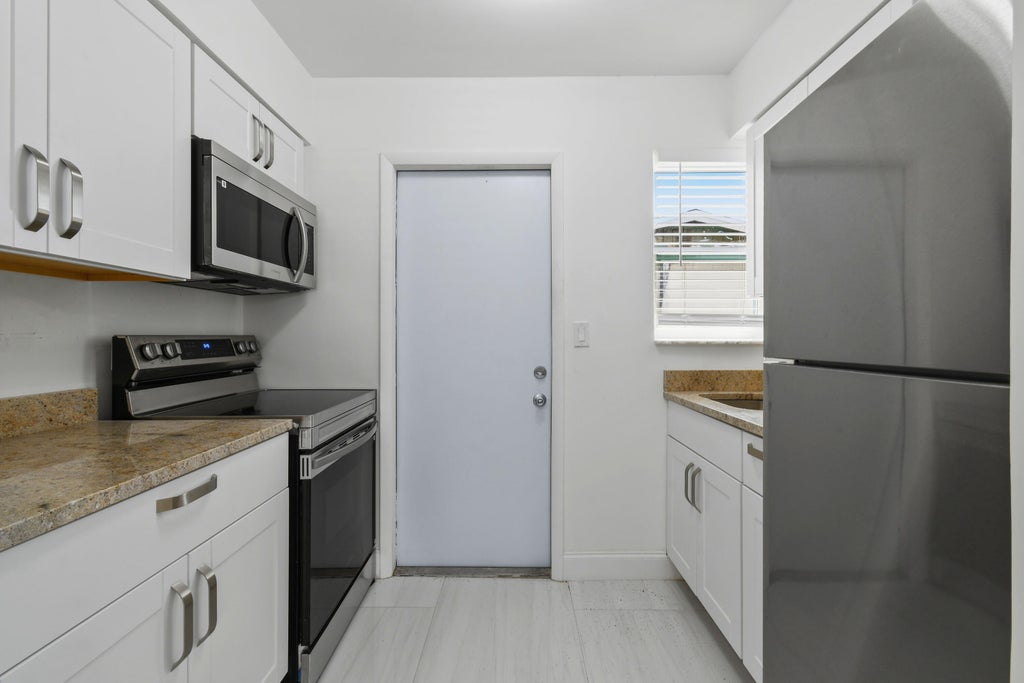 Photo of 968 W 9TH Street #B2, Riviera Beach, FL 33404 (MLS # B26062566)