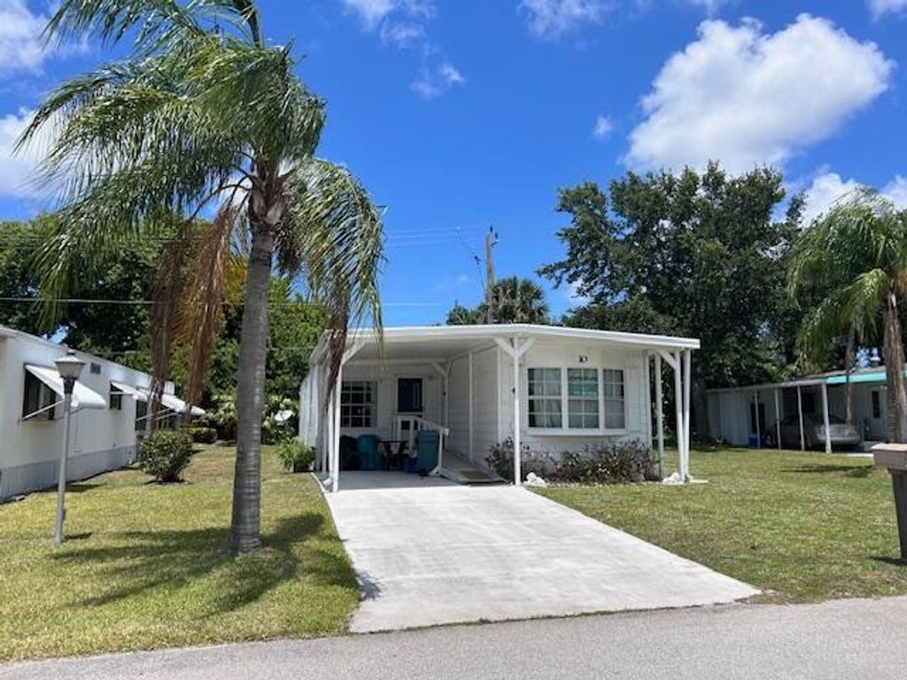 Photo of 10 Cozumel Lane, Port Saint Lucie, FL 34952 (MLS # R10984567)