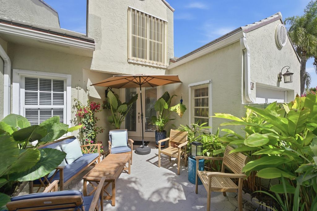 Photo of 47 N Lakeshore Drive, Hypoluxo, FL 33462 (MLS # B26015465)