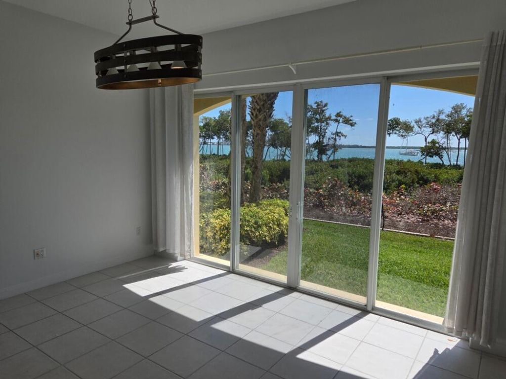 Photo of 23 Harbor Isle Dr Drive W #104, Fort Pierce, FL 34949 (MLS # R11165460)