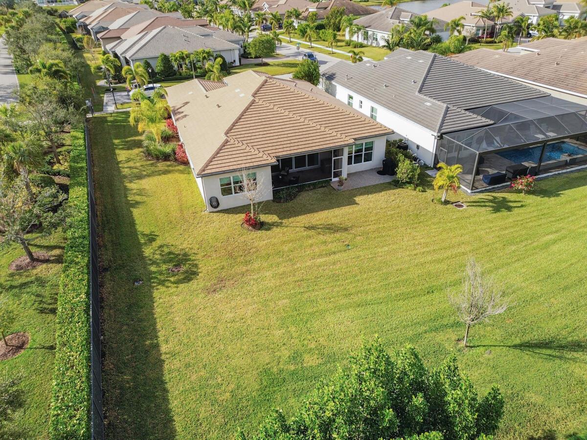 Welcome to Riverland, where luxury resort-style living is like no other in Port St Lucie! The Caroline is one of Riverland's most popular models and perfect for entertaining. This beautiful home has a gorgeous expansive eastern garden view from the back patio and features numerous upgrades. This premier oversized lot is located at the end of the street with its own entrance to the 2-lane scenic landscaped miles long Paseo for golf carts, biking and walking. The amenities include a 34,000 sq ft clubhouse with stunning resort-style pool, restaurant, amazing live entertainment, dozens of clubs; a 24-acre fitness campus w/ a state-of-the-art gym, 3 outdoor pools and 1 indoor pool; learn to cook, paint, or even create pottery at the arts and culture center; The upcoming